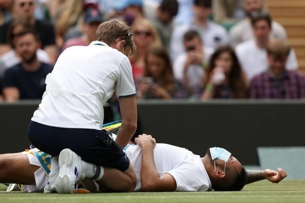 Australia's Nick Kyrgios receives treatment during play against Canada's Felix Auger-Aliassime during their men's singles third round match on the...