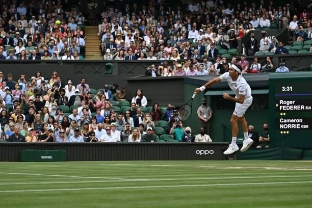 Switzerland's Roger Federer serves against Britain's Cameron Norrie during their men's singles third round match on the sixth day of the 2021...