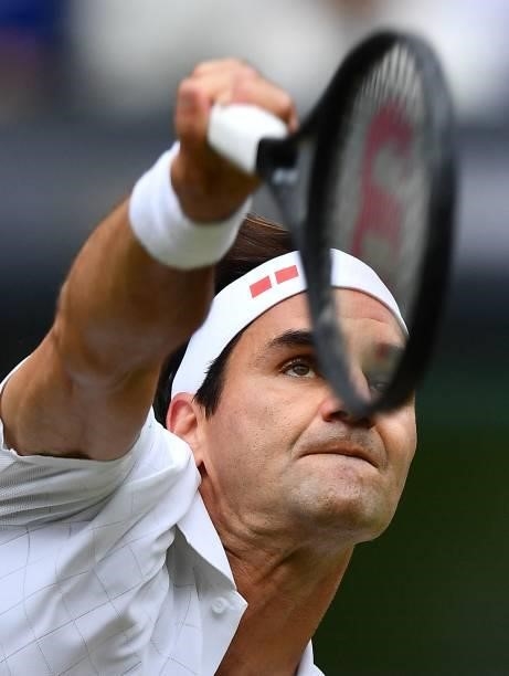 Switzerland's Roger Federer serves against Britain's Cameron Norrie during their men's singles third round match on the sixth day of the 2021...