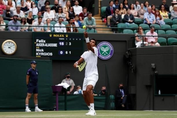 Canada's Felix Auger-Aliassime serves against Australia's Nick Kyrgios during their men's singles third round match on the sixth day of the 2021...