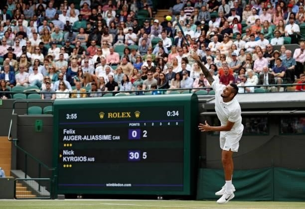Australia's Nick Kyrgios serves against Canada's Felix Auger-Aliassime during their men's singles third round match on the sixth day of the 2021...