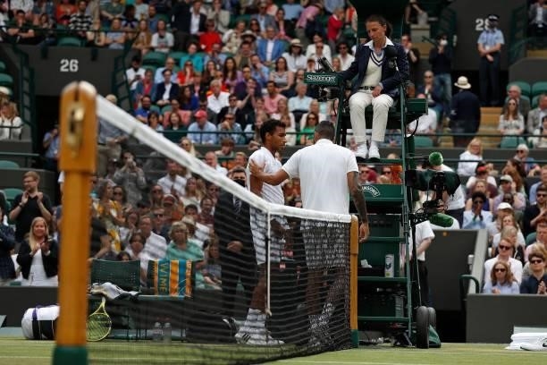 Australia's Nick Kyrgios talks with Canada's Felix Auger-Aliassime after withdrawing from their men's singles third round match on the sixth day of...