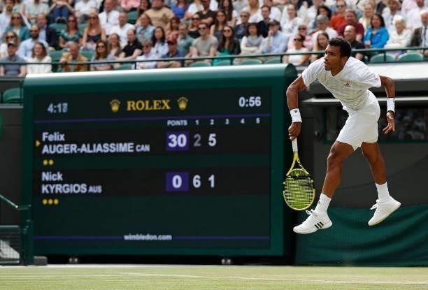 Canada's Felix Auger-Aliassime serves against Australia's Nick Kyrgios during their men's singles third round match on the sixth day of the 2021...