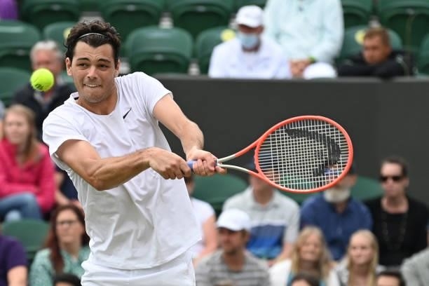 Player Taylor Fritz returns to Germany's Alexander Zverev during their men's singles third round match on the sixth day of the 2021 Wimbledon...