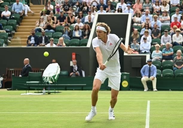 Germany's Alexander Zverev returns to US player Taylor Fritz during their men's singles third round match on the sixth day of the 2021 Wimbledon...