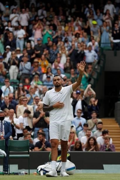 Australia's Nick Kyrgios waves to the crowd after withdrawing from his match against Canada's Felix Auger-Aliassime in their men's singles third...