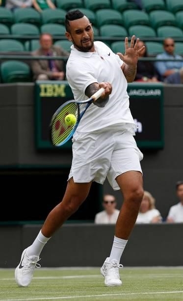 Australia's Nick Kyrgios returns against Canada's Felix Auger-Aliassime during their men's singles third round match on the sixth day of the 2021...