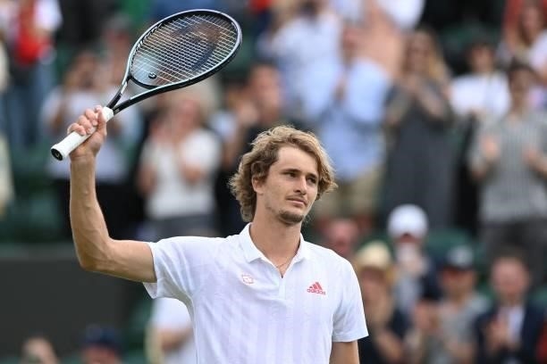 Germany's Alexander Zverev celebrates after beating US player Taylor Fritz during their men's singles third round match on the sixth day of the 2021...