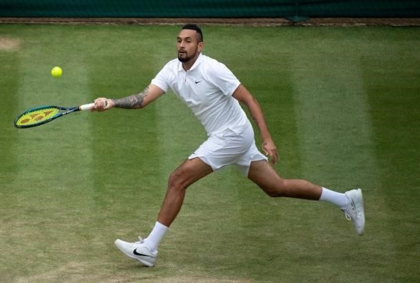Australia's Nick Kyrgios returns to Canada's Felix Auger-Aliassime during their men's singles third round match on the sixth day of the 2021...