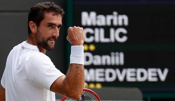 Croatia's Marin Cilic celebrates winning a point against Russia's Daniil Medvedev during their men's singles third round match on the sixth day of...
