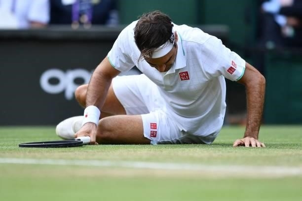 Switzerland's Roger Federer slips during play against Britain's Cameron Norrie during their men's singles third round match on the sixth day of the...