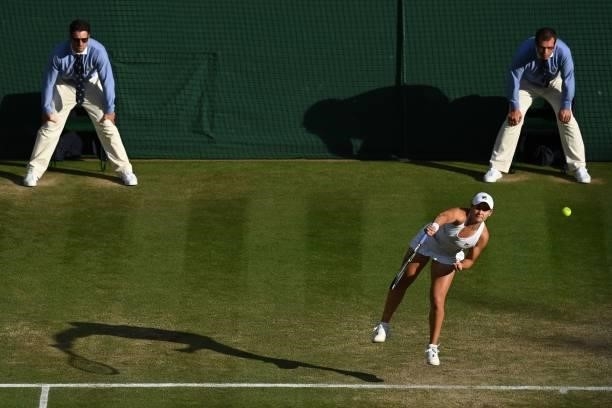 Australia's Ashleigh Barty serves to Czech Republic's Katerina Siniakova during their women's singles third round match on the sixth day of the 2021...