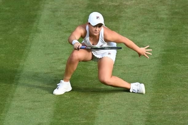 Australia's Ashleigh Barty returns to Czech Republic's Katerina Siniakova during their women's singles third round match on the sixth day of the 2021...