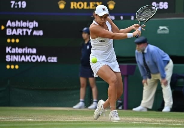 Australia's Ashleigh Barty returns against Czech Republic's Katerina Siniakova during their women's singles third round match on the sixth day of the...