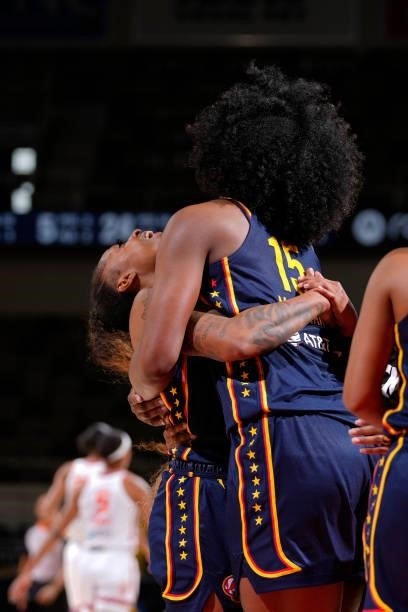 Tiffany Mitchell celebrates with teammate Teaira McCowan of the Indiana Fever after the game against the Connecticut Sun on July 3, 2021 at Indiana...