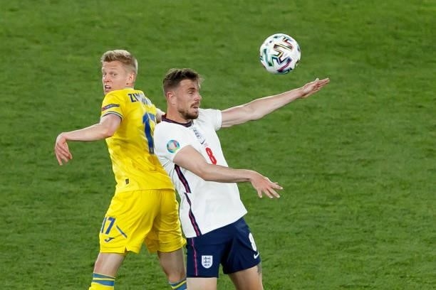 Oleksandr Zinchenko of Ukraine and Jordan Henderson of England battle for the ball during the UEFA Euro 2020 Championship Quarter-final match between...