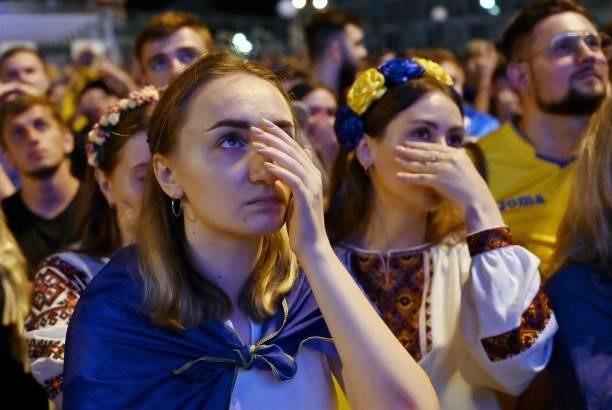 SupinskyUkraine's fans react as they watch on a giant screen the broadcast of the UEFA EURO 2020 quarter-final football match between England and...