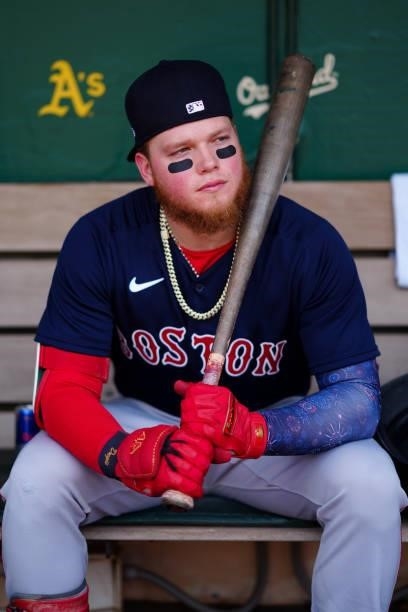 Alex Verdugo of the Boston Red Sox looks on from the dugout before the game between the Boston Red Sox and the Oakland Athletics at Oakland Coliseum...