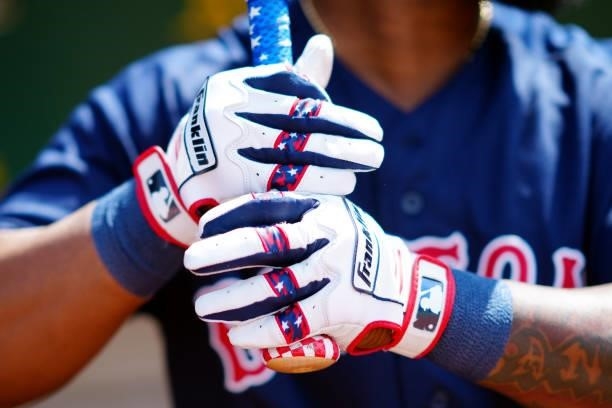 Detail view of Danny Santana of the Boston Red Sox batting gloves before the game between the Boston Red Sox and the Oakland Athletics at Oakland...