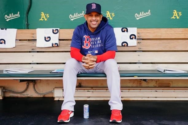 Manager Alex Cora of the Boston Red Sox looks on from the dugout before the game between the Boston Red Sox and the Oakland Athletics at Oakland...