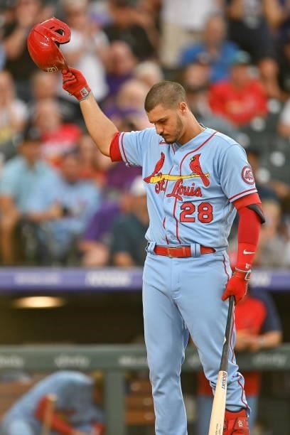Nolan Arenado of the St. Louis Cardinals acknowledges cheers from the crowd before a plate appearance against the Colorado Rockies at Coors Field on...