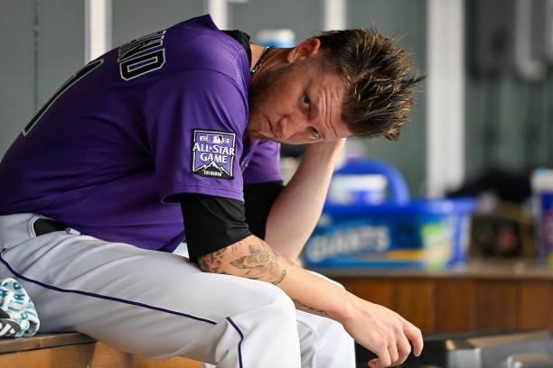Kyle Freeland of the Colorado Rockies looks on while sitting in the dugout during a game against the St. Louis Cardinals at Coors Field on July 3,...