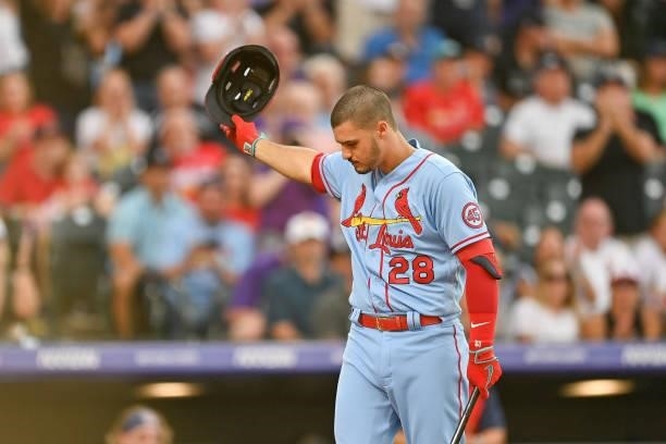 Nolan Arenado of the St. Louis Cardinals acknowledges cheers from the crowd before a plate appearance against the Colorado Rockies at Coors Field on...