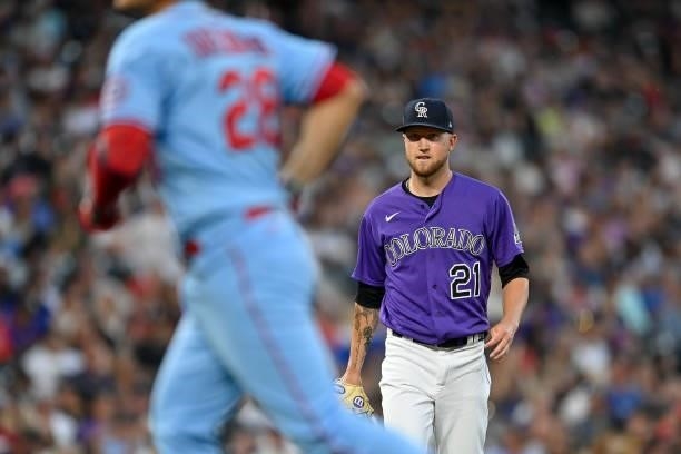 Kyle Freeland of the Colorado Rockies watches as Nolan Arenado of the St. Louis Cardinals returns to the dugout after a fly out in the fourth inning...