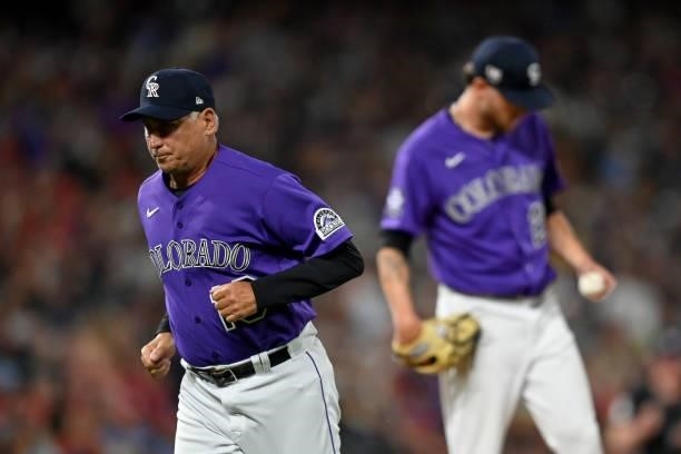 Bud Black of the Colorado Rockies jogs to the dugout after a mound visit with Kyle Freeland during the sixth inning of a game against the St. Louis...