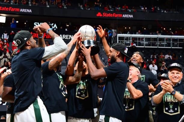 Khris Middleton and the Milwaukee Bucks hold the Eastern Conference Finals Trophy during Game 6 of the Eastern Conference Finals of the 2021 NBA...