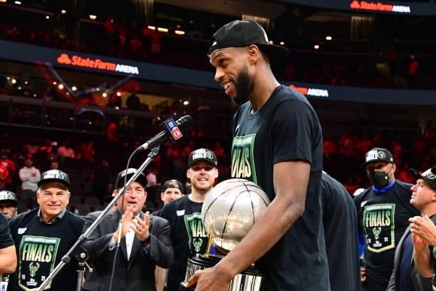 Khris Middleton of the Milwaukee Bucks holds the Eastern Conference Finals Trophy during Game 6 of the Eastern Conference Finals of the 2021 NBA...