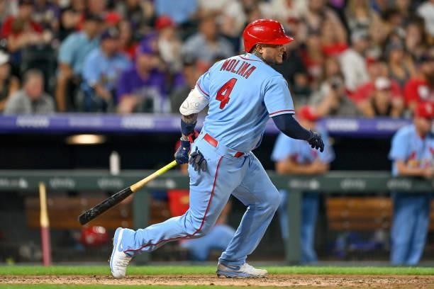 Yadier Molina of the St. Louis Cardinals hits an eighth inning RBI single against the Colorado Rockies at Coors Field on July 3, 2021 in Denver,...