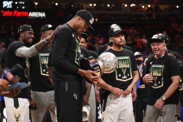 Giannis Antetokounmpo of the Milwaukee Bucks holds the Eastern Conference Final Trophy after the game against the Atlanta Hawks during Game 6 of the...