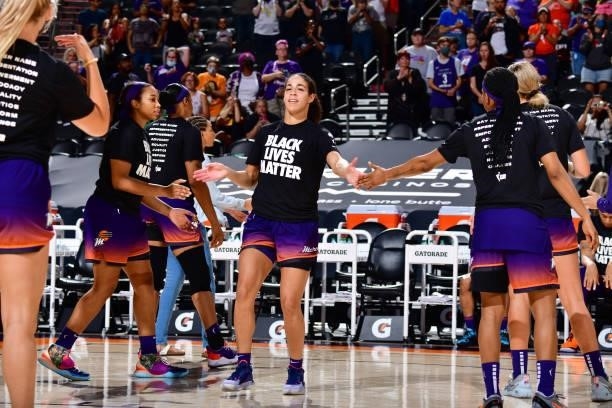 Kia Nurse of the Phoenix Mercury high fives her teammates before the game against the Minnesota Lynx on July 3, 2021 at the Phoenix Suns Arena in...