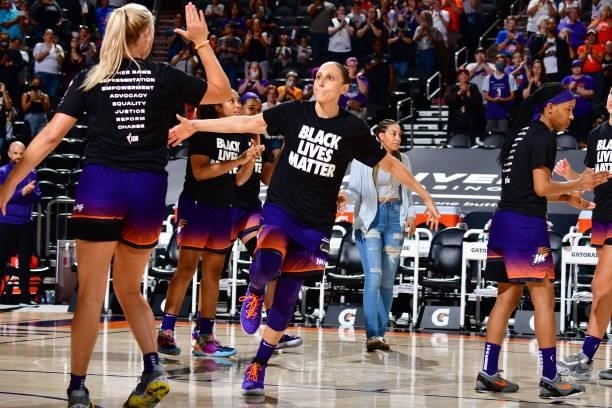 Diana Taurasi of the Phoenix Mercury high fives her teammates before the game against the Minnesota Lynx on July 3, 2021 at the Phoenix Suns Arena in...