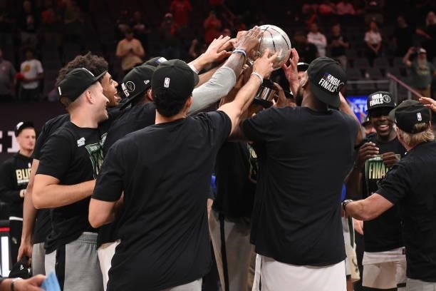 Milwaukee Bucks players hold up the Eastern Conference Finals Trophy after the game against the Atlanta Hawks during Game 6 of the Eastern Conference...
