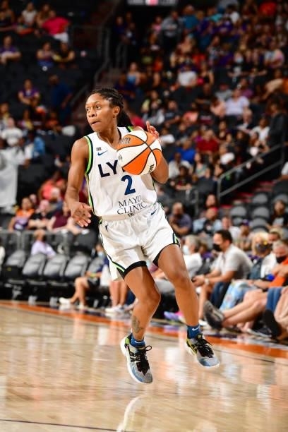 Crystal Dangerfield of the Minnesota Lynx dribbles the ball against the Phoenix Mercury on July 3, 2021 at the Phoenix Suns Arena in Phoenix,...