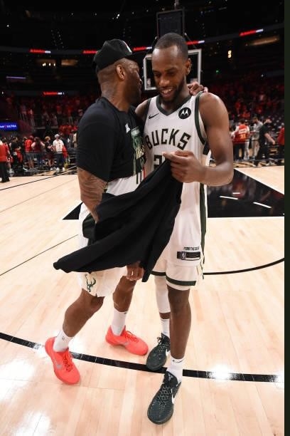 Tucker of the Milwaukee Bucks hugs teammate Khris Middleton after the game against the Atlanta Hawks during Game 6 of the Eastern Conference Finals...