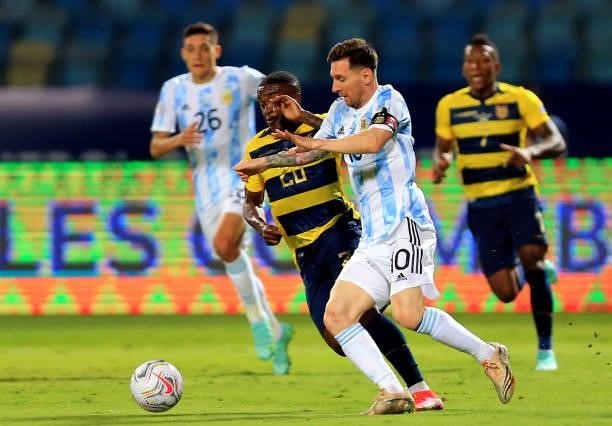 Lionel Messi of Argentina competes for the ball with Jhegson Mendez of Ecuador, during the Quarterfinal match between Argentina and Ecuador as part...