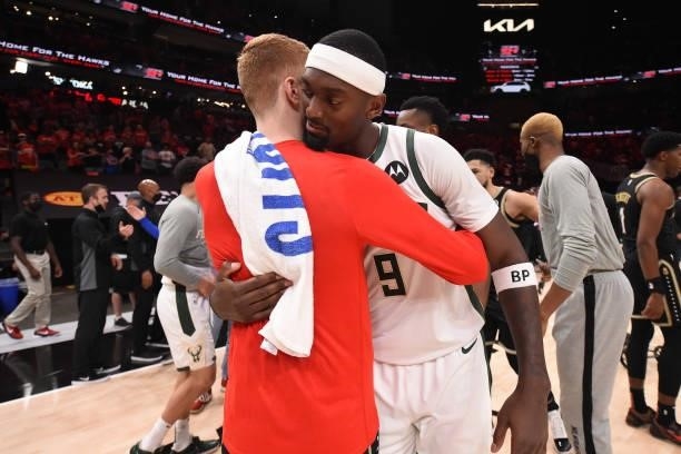 Bobby Portis of the Milwaukee Bucks hugs Kevin Huerter of the Atlanta Hawks after the game during Game 6 of the Eastern Conference Finals of the 2021...