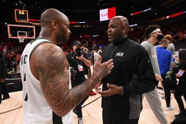 Tucker of the Milwaukee Bucks high-fives Head Coach Nate McMillan of the Atlanta Hawks after the game during Game 6 of the Eastern Conference Finals...