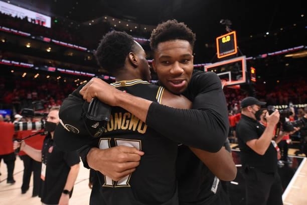 Giannis Antetokounmpo of the Milwaukee Bucks hugs Onyeka Okongwu of the Atlanta Hawks after the game during Game 6 of the Eastern Conference Finals...