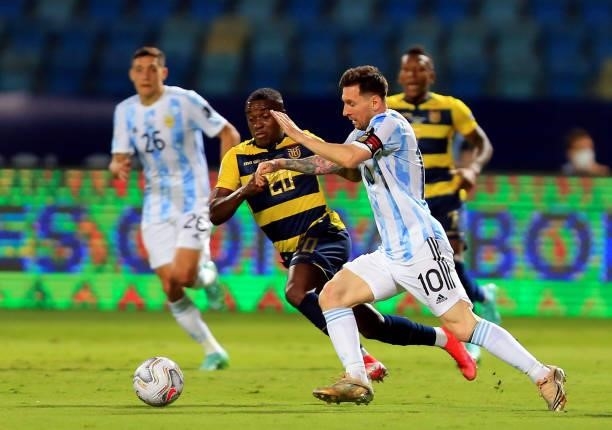 Lionel Messi of Argentina competes for the ball with Jhegson Mendez of Ecuador, during the Quarterfinal match between Argentina and Ecuador as part...
