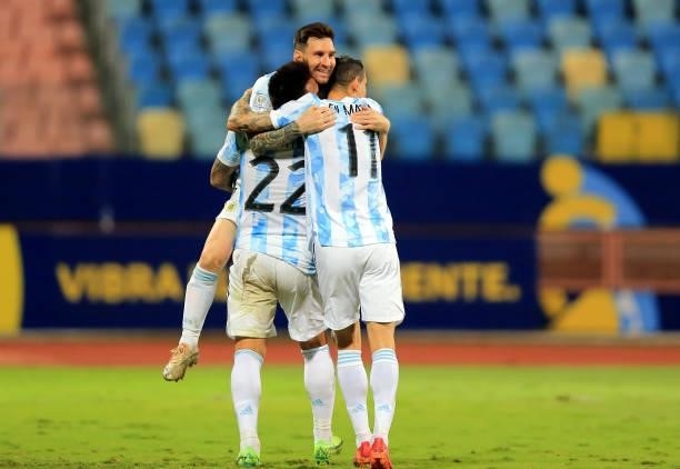 Lautaro Martinez of Argentina celebrates with his team mates Lionel Messi and Angel Di Maria after scores his goal during the Conmebol Copa America...