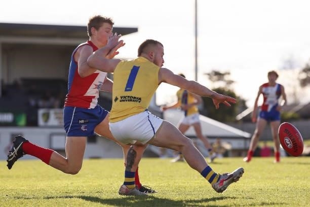 Lucas Failli of the Jets competes for the ball with Hugh Dunbar of the Power during the NAB League match between Gippsland Power and the Western Jets...