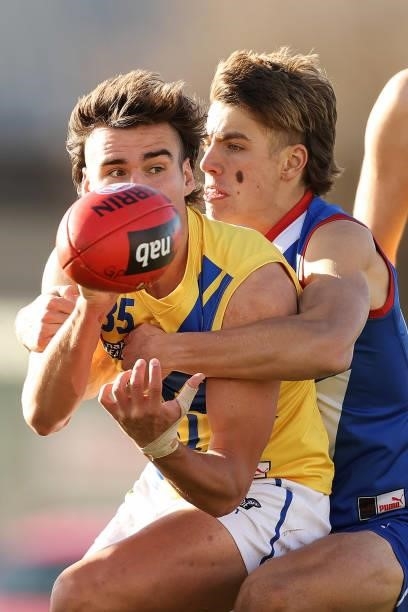 Liam Conway of the Jets is tackled by Jai Serong of the Power during the NAB League match between Gippsland Power and the Western Jets at Morwell...