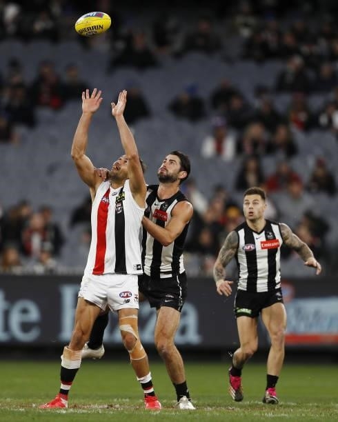 Paddy Ryder of the Saints and Brodie Grundy of the Magpies compete for the ball during the 2021 AFL Round 16 match between the Collingwood Magpies...