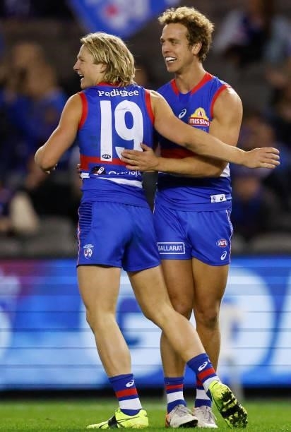 Cody Weightman and Mitch Wallis of the Bulldogs celebrate during the 2021 AFL Round 16 match between the Western Bulldogs and the North Melbourne...