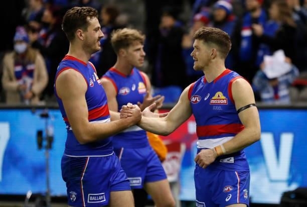 Zaine Cordy and Taylor Duryea of the Bulldogs celebrate during the 2021 AFL Round 16 match between the Western Bulldogs and the North Melbourne...