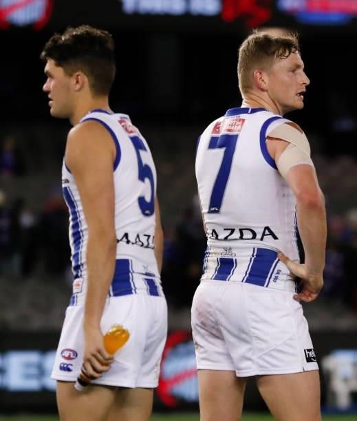 Curtis Taylor and Jack Ziebell of the Kangaroos look dejected after a loss during the 2021 AFL Round 16 match between the Western Bulldogs and the...